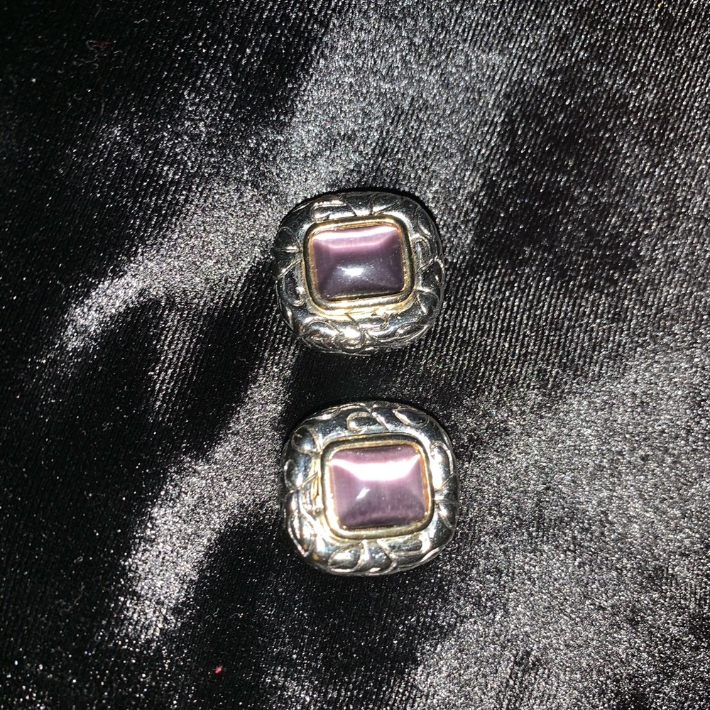 Silver colored clip on earrings with purple stone